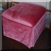 F55. Pink velvet ottoman on wheels. 
